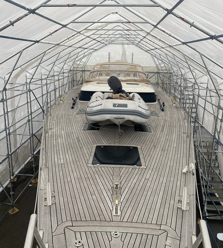 Building encapsulated in white shrink wrap weather protection