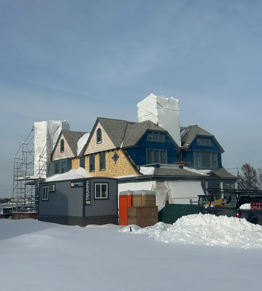 Building sealed in white shrink wrap with snow on the ground